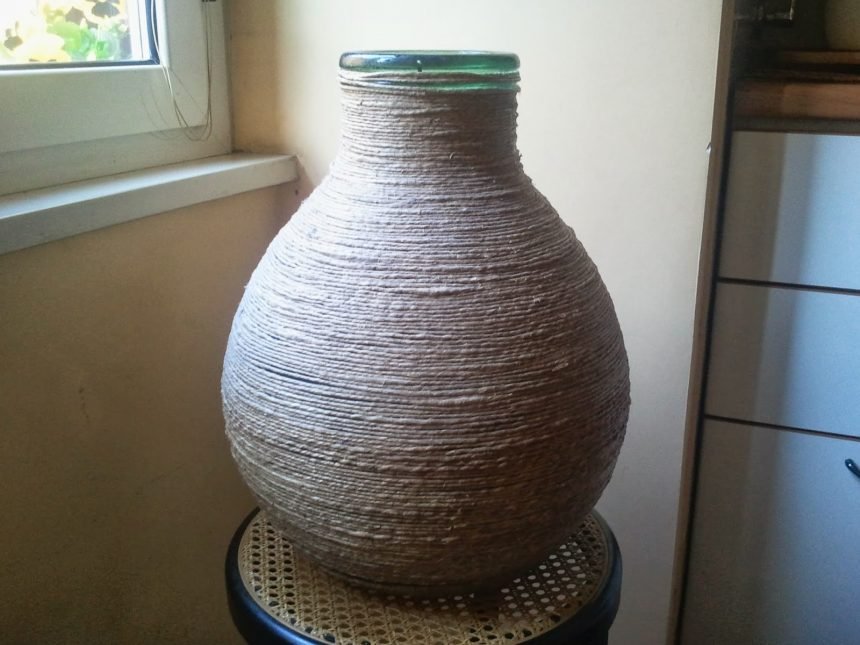 carboy decorated with rope