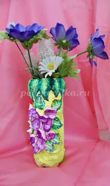 vase with flowers from a plastic bottle