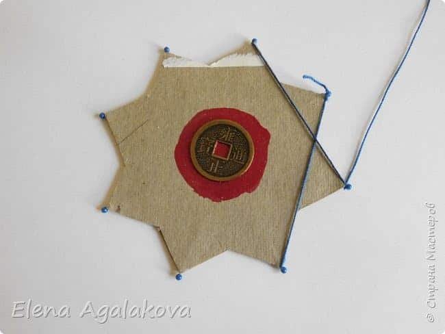 weaving of mandala on a cardboard basis