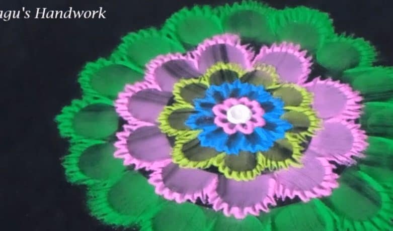 Free hand flower rangoli making