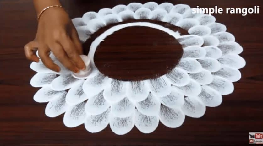 How to make beautiful flower rangoli in 2 minutes