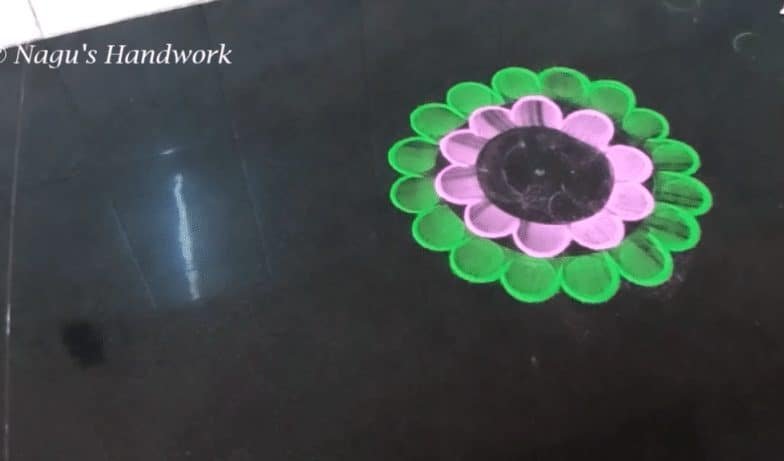 Free hand flower rangoli making