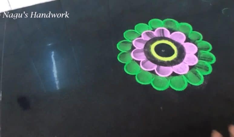 Free hand flower rangoli making
