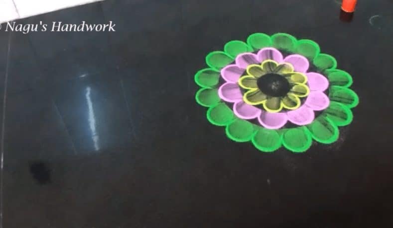 Free hand flower rangoli making