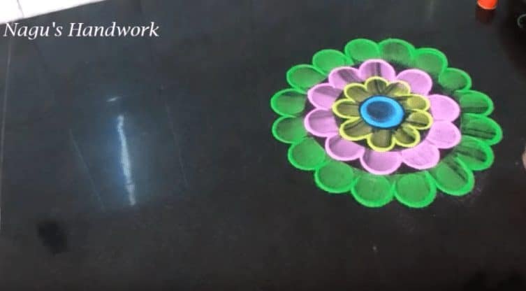 Free hand flower rangoli making