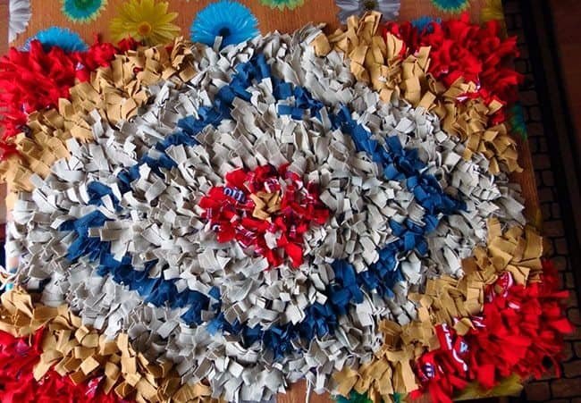 shaggy rug of old t-shirts on a knitted mesh
