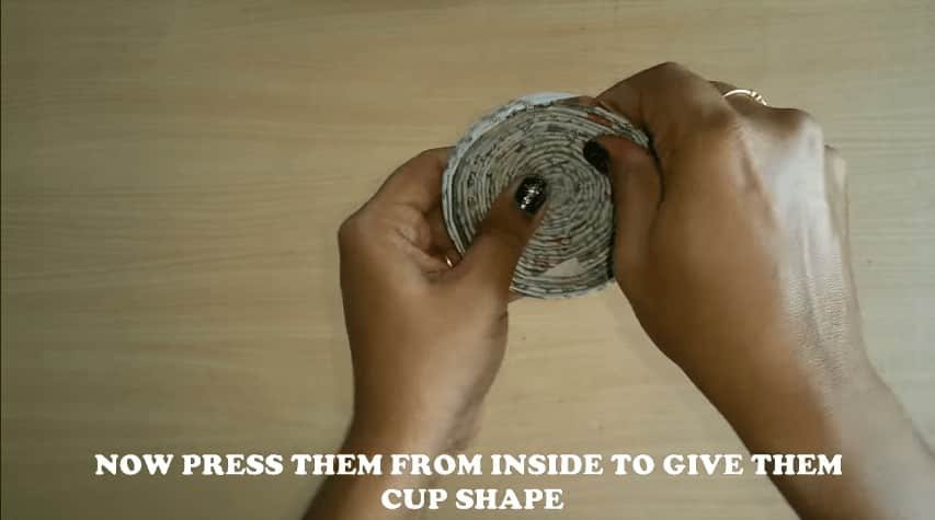 How to make newspaper bell wall hanging