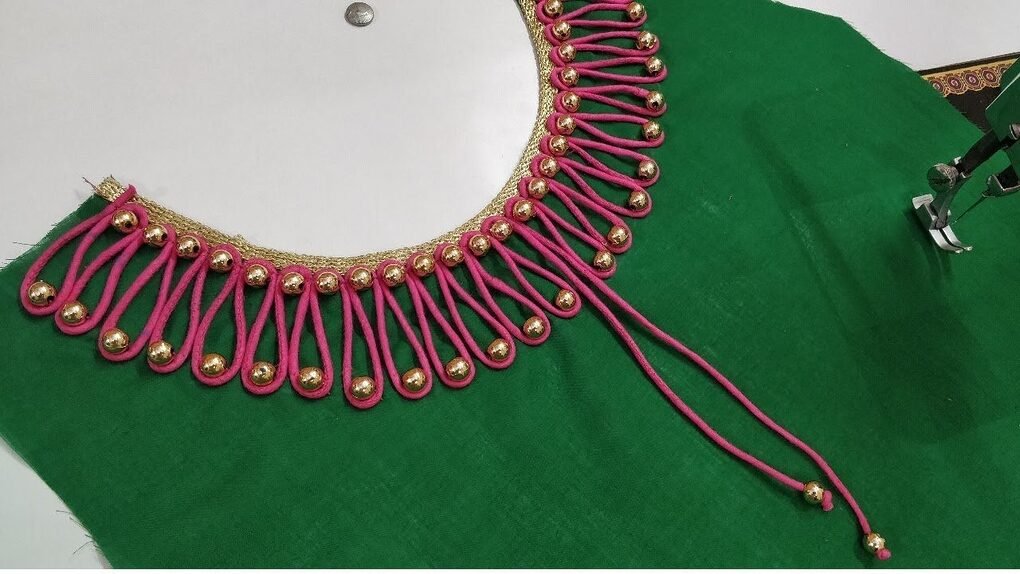 Very creative beaded boat neck design for kurti - Simple 