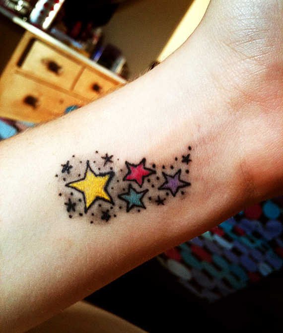Colorful stars tattoo