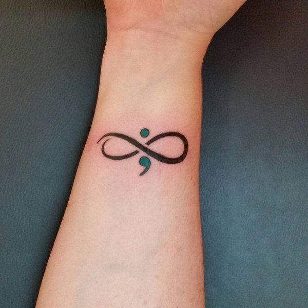 Infinity dot and comma tattoo