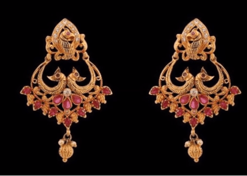 Gold peacock design earrings