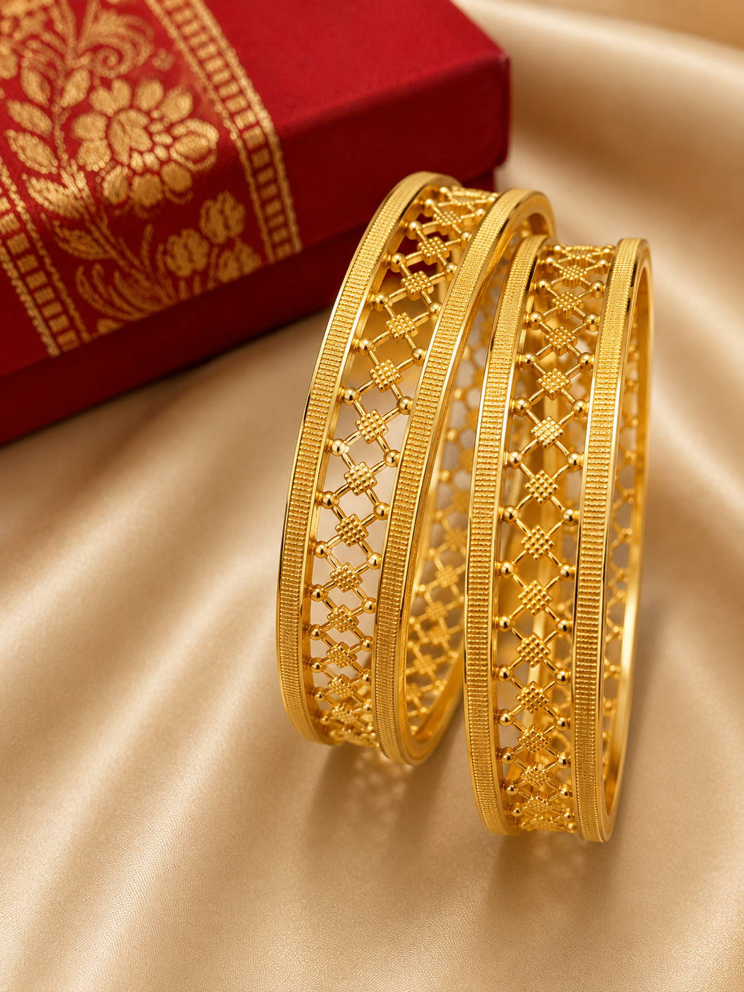 Latest Gold Bangle Designs That Define Timeless Elegance Lattice Gold Bangles: These gold bangles have a neat open lattice pattern with fine textured edges for a simple and elegant traditional jewelry look.