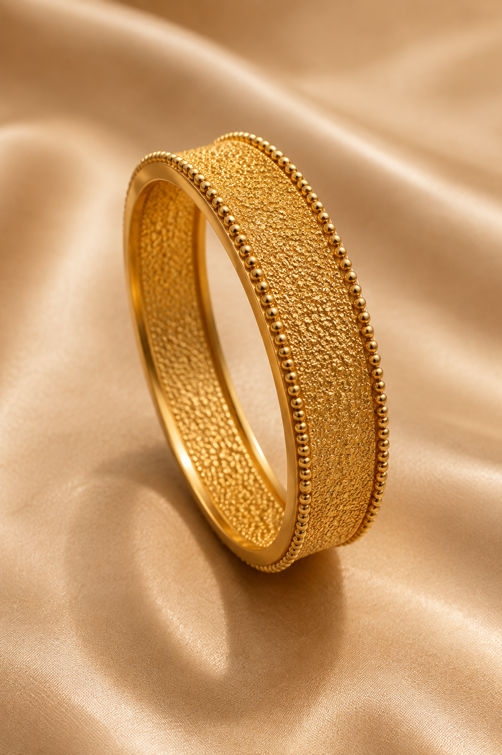Latest Gold Bangle Designs That Define Timeless Elegance Filigree Gold Bangle
: This gold bangle has fine filigree work and a neat beaded edge for a simple and elegant traditional jewelry look.